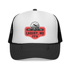 White and black trucker hat with red and black logo on a white background